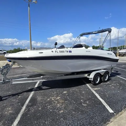 Slide: The Image of 2023 Hurricane Sundeck Sport 218 OB boat on trailer in parking lot. - 6