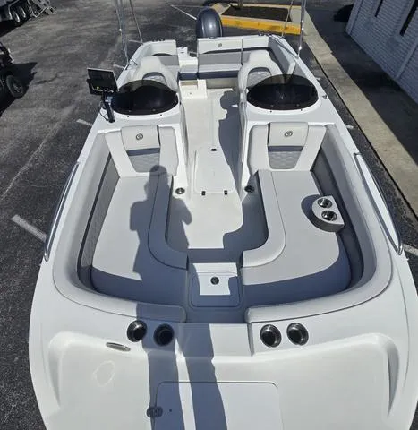 Slide: The Image of 2023 Hurricane Sundeck Sport 218 OB boat interior with seating and console. - 7