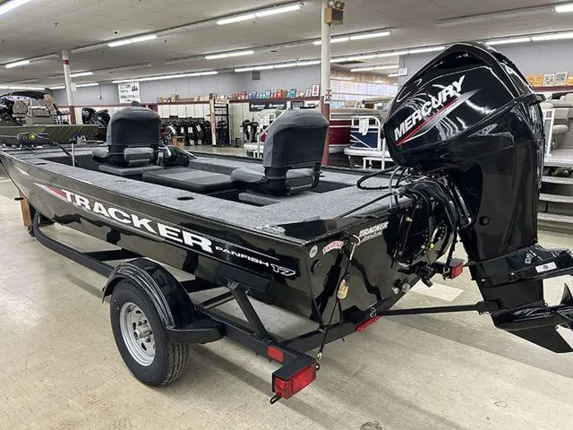 Slide: The Image of 2025 Tracker Panfish™ 17 boat with Mercury engine on display indoors. - 6