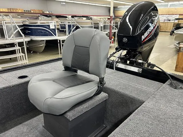 Slide: The Image of 2025 Tracker Panfish™ 17 boat with gray seat and Mercury outboard motor in showroom. - 7
