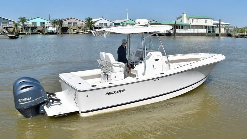 Slide: The Image of 2015 Regulator 25 boat with Yamaha engine on calm water. - 6