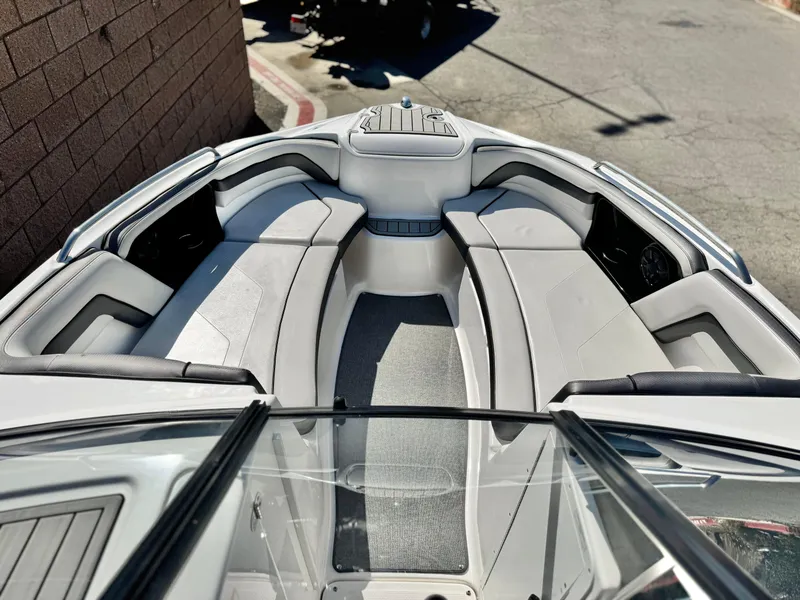 Slide: The Image of 2020 Yamaha Boats AR240 interior with sleek seating and modern design. - 13