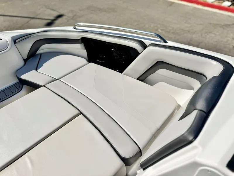 Slide: The Image of 2020 Yamaha Boats AR240 interior seating with sleek, modern design and comfortable upholstery. - 15