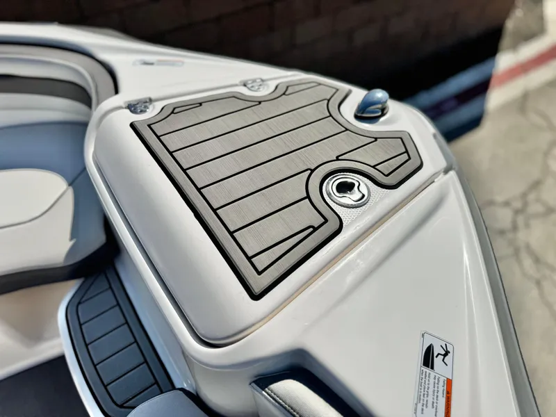 Slide: The Image of 2020 Yamaha Boats AR240 deck detail with textured surface and sleek design. - 16