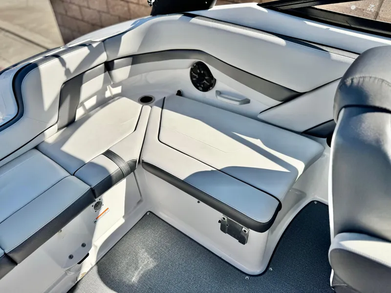 Slide: The Image of 2020 Yamaha Boats AR240 interior seating with sleek, modern design and comfortable upholstery. - 21