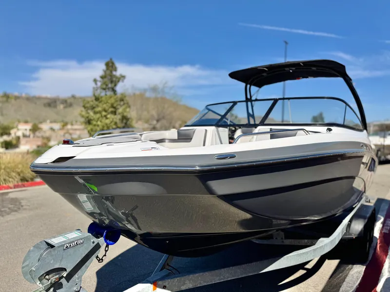 Slide: The Image of 2020 Yamaha Boats AR240 on trailer, sleek design, sunny day, outdoor setting. - 3