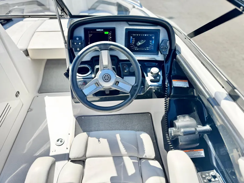 Slide: The Image of 2020 Yamaha AR240 boat cockpit with steering wheel and digital displays. - 31