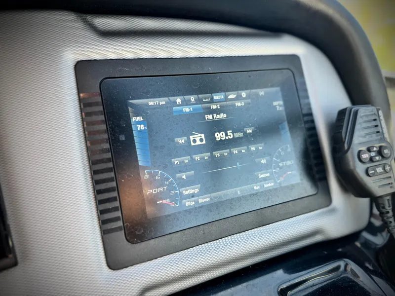 Slide: The Image of Dashboard display of a 2020 Yamaha AR240 boat showing FM radio at 99.5 MHz. - 38