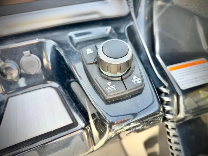 Slide: The Image of Control panel of a 2020 Yamaha Boats AR240, featuring cruise control settings. - 39