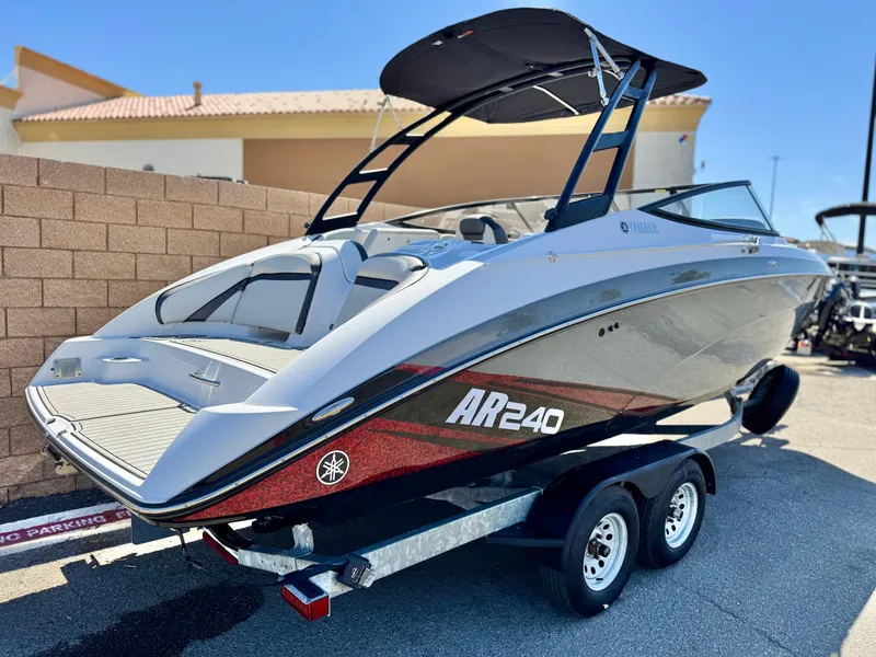 Slide: The Image of 2020 Yamaha AR240 boat on trailer, sleek design, black and white color scheme. - 5