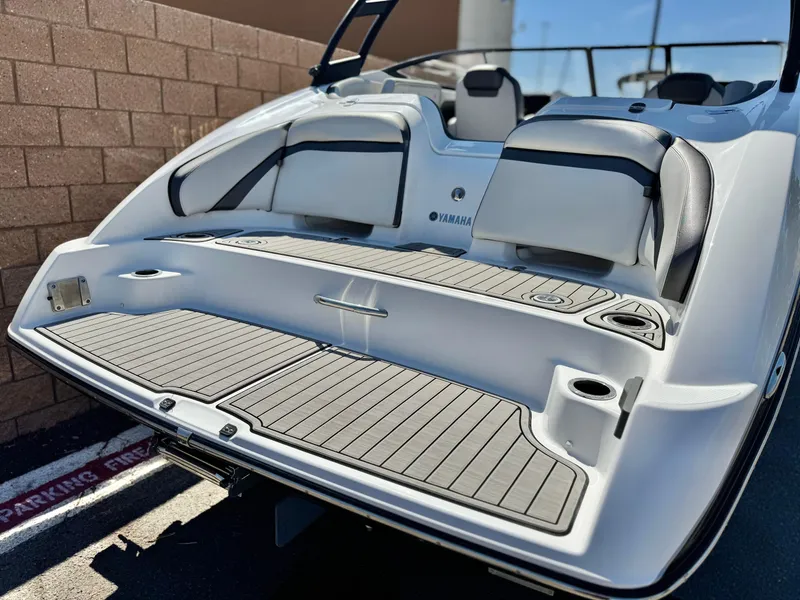 Slide: The Image of 2020 Yamaha Boats AR240, rear view, showcasing swim platform and seating area. - 6