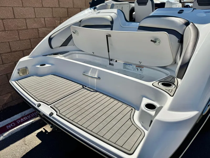 Slide: The Image of 2020 Yamaha AR240 boat with open storage compartment and sleek design. - 7