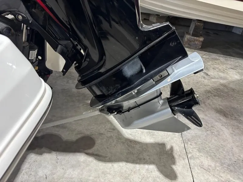 Slide: The Image of Outboard motor of a 2020 Tahoe 450 TF boat on concrete floor. - 9