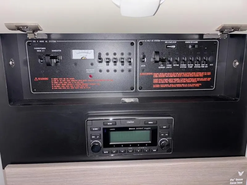 Slide: The Image of Control panel and stereo system in a 2019 Formula 350 Crossover Bowrider boat. - 16