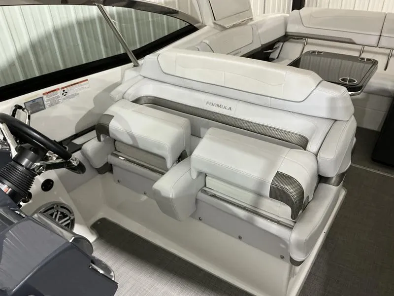 Slide: The Image of 2019 Formula 350 Crossover Bowrider interior with plush seating and modern helm design. - 18