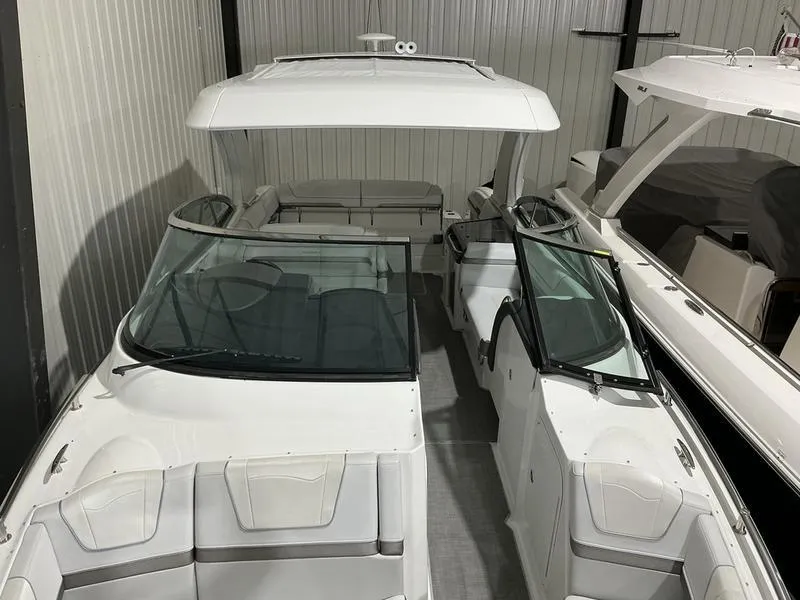 Slide: The Image of 2019 Formula 350 Crossover Bowrider in storage, showcasing sleek design and spacious seating. - 23