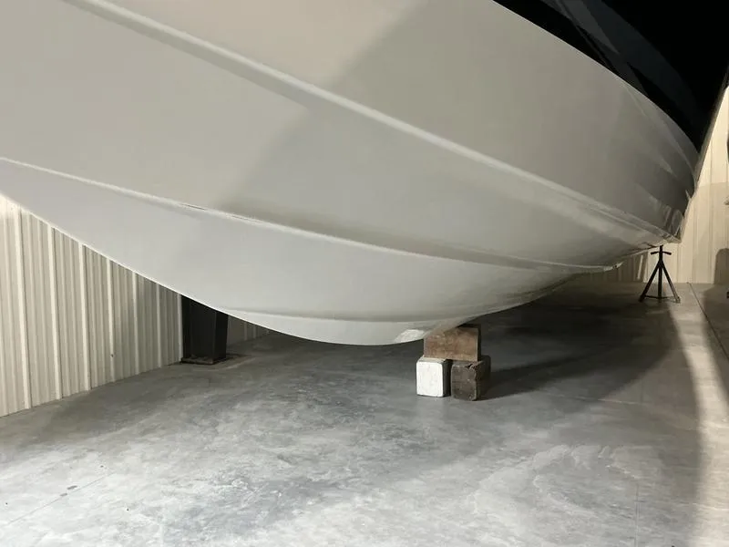 Slide: The Image of 2019 Formula 350 Crossover Bowrider boat hull in storage on concrete floor. - 25