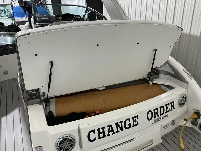 Slide: The Image of 2019 Formula 350 Crossover Bowrider with open storage compartment, labeled "Change Order." - 6