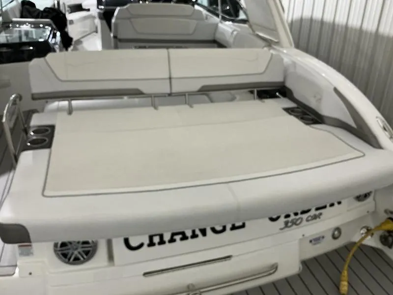 Slide: The Image of 2019 Formula 350 Crossover Bowrider, rear view with spacious seating and sleek design. - 7