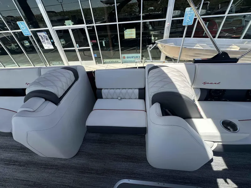 Slide: The Image of Luxurious seating on 2025 Bennington 25 RXSB pontoon boat, featuring elegant white upholstery. - 10