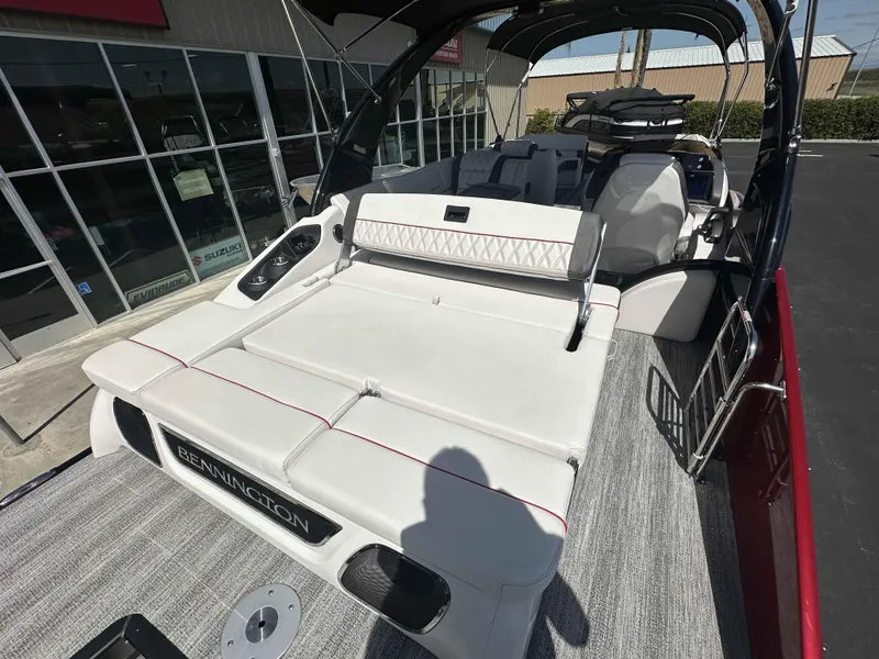 Slide: The Image of 2025 Bennington 25 RXSB boat interior with white seating and modern design. - 16