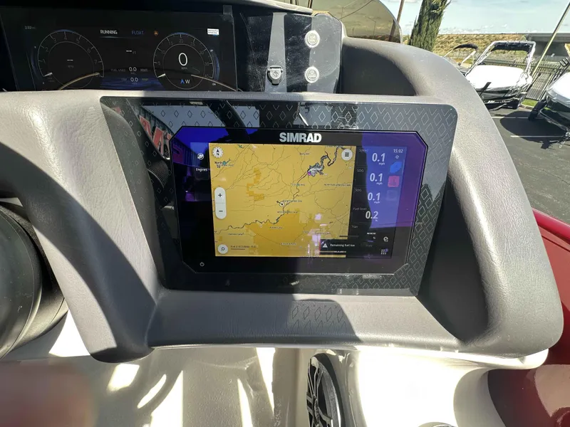Slide: The Image of Dashboard of a 2025 Bennington 25 RXSB with Simrad navigation display. - 19