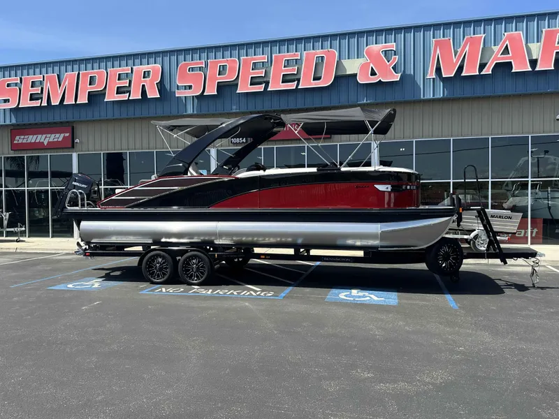 Slide: The Image of 2025 Bennington 25 RXSB pontoon boat on trailer at dealership. - 23