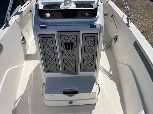 Slide: The Image of 2019 Wellcraft 18 CC boat interior with console and seating area. - 10