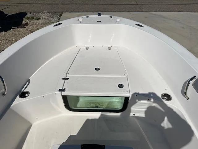 Slide: The Image of 2019 Wellcraft 18 CC boat interior with storage compartment and stainless steel handles. - 12