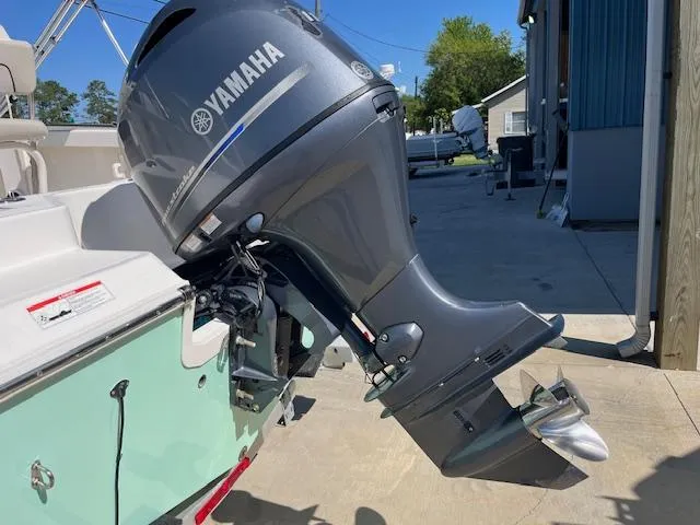 Slide: The Image of 2019 Wellcraft 18 CC boat with Yamaha outboard motor, parked outdoors. - 4