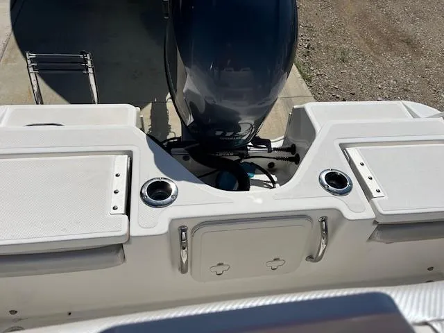 Slide: The Image of 2019 Wellcraft 18 CC boat stern with motor and storage compartments. - 5