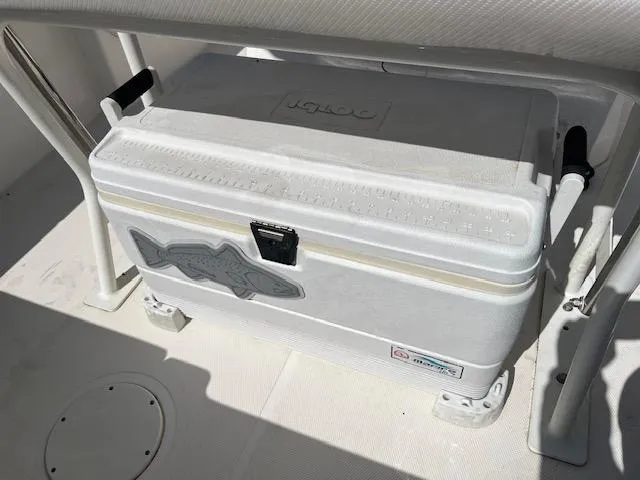 Slide: The Image of White Igloo cooler on 2019 Wellcraft 18 CC boat deck, secured with brackets. - 7
