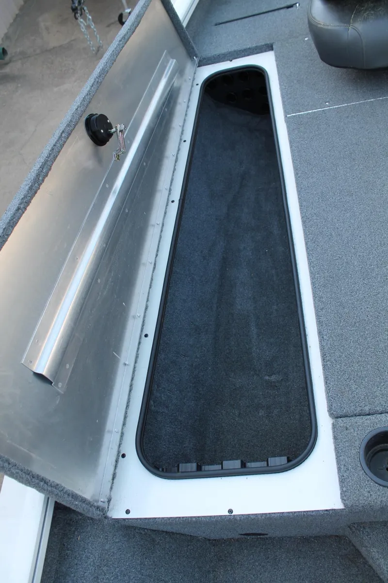 Slide: The Image of Open storage compartment in 2022 Tracker Pro Team 190 TX boat. - 10