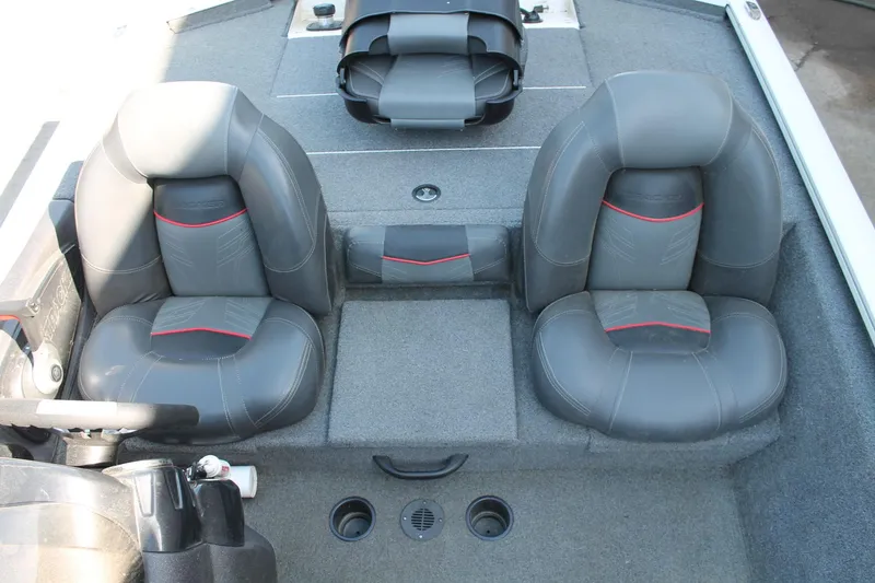 Slide: The Image of 2022 Tracker Pro Team 190 TX boat interior with dual gray seats and red accents. - 12