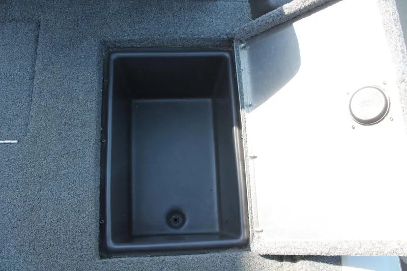 Slide: The Image of Open storage compartment in 2022 Tracker Pro Team 190 TX boat. - 14
