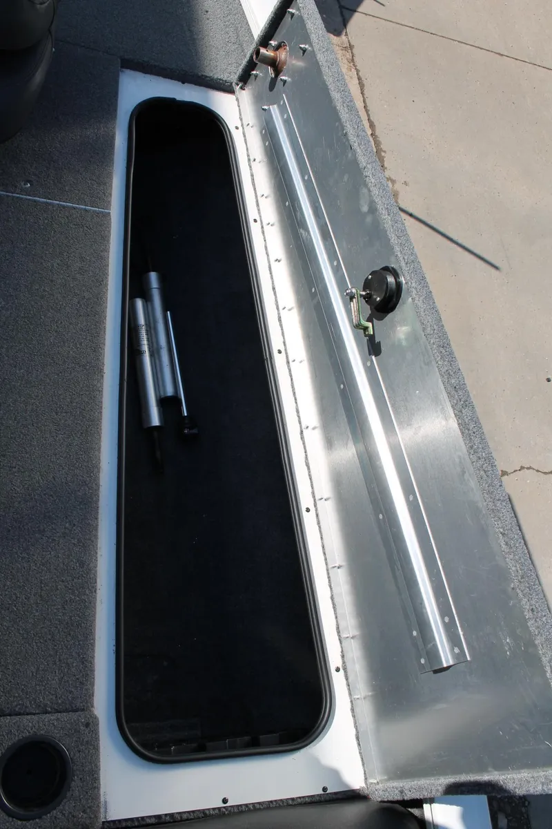 Slide: The Image of 2022 Tracker Pro Team 190 TX boat storage compartment with hydraulic struts. - 22