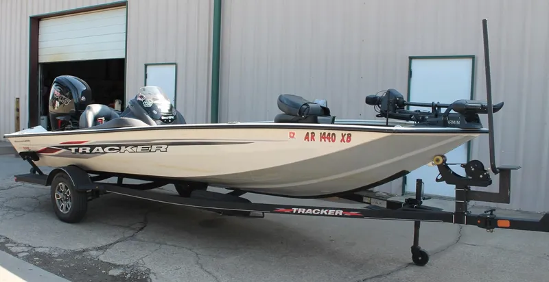 Slide: The Image of 2022 Tracker Pro Team 190 TX boat on trailer outside a garage. - 3