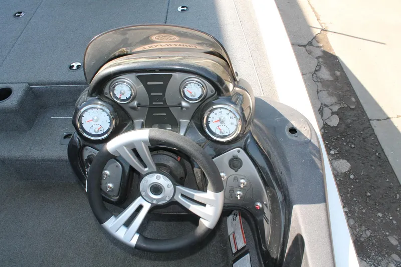 Slide: The Image of 2022 Tracker Pro Team 190 TX boat dashboard with steering wheel and gauges. - 6