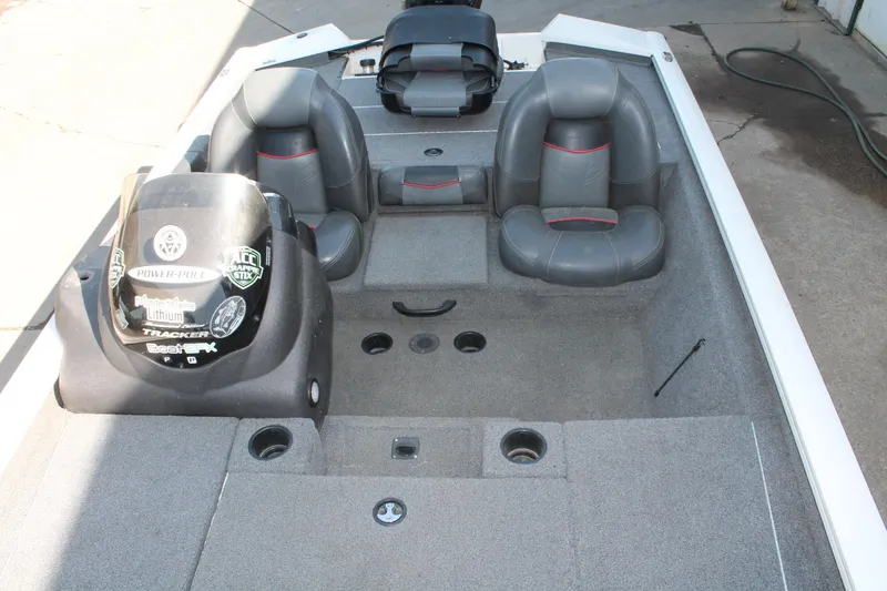 Slide: The Image of 2022 Tracker Pro Team 190 TX boat interior with gray seating and console. - 8