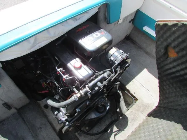 Slide: The Image of Engine compartment of a 1995 Seaswirl 180 boat, showcasing mechanical components. - 10