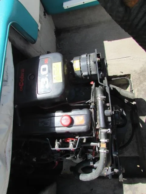 Slide: The Image of Engine compartment of a 1995 Seaswirl 180 boat, featuring a 3.0L OMC Cobra engine. - 11