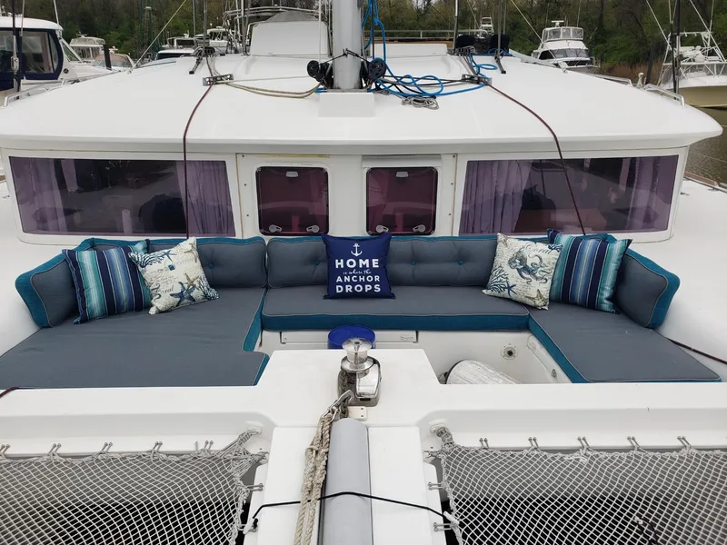 The Image of Catamaran Lagoon 450, 2011 model, with cozy outdoor seating and decorative pillows. - 0