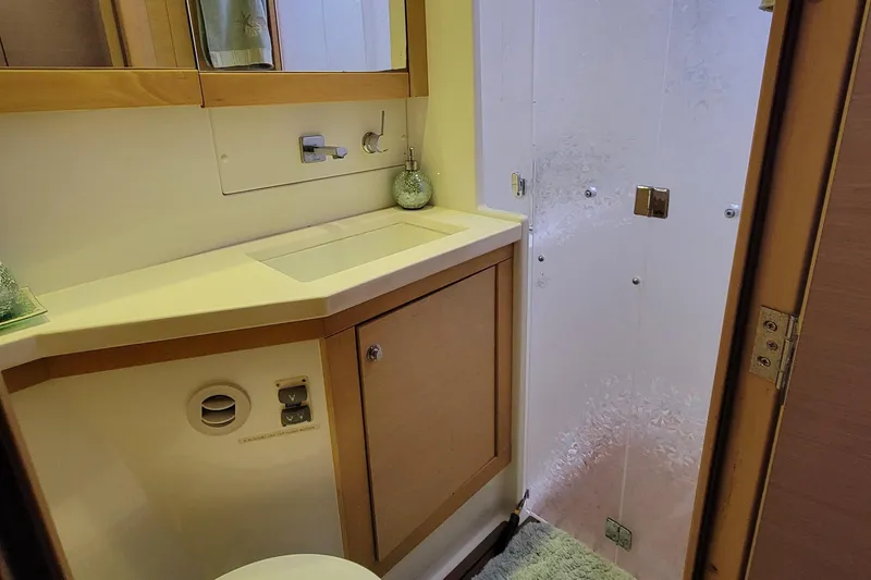 Slide: The Image of Bathroom interior of 2011 Lagoon 450 yacht with modern fixtures and shower. - 14