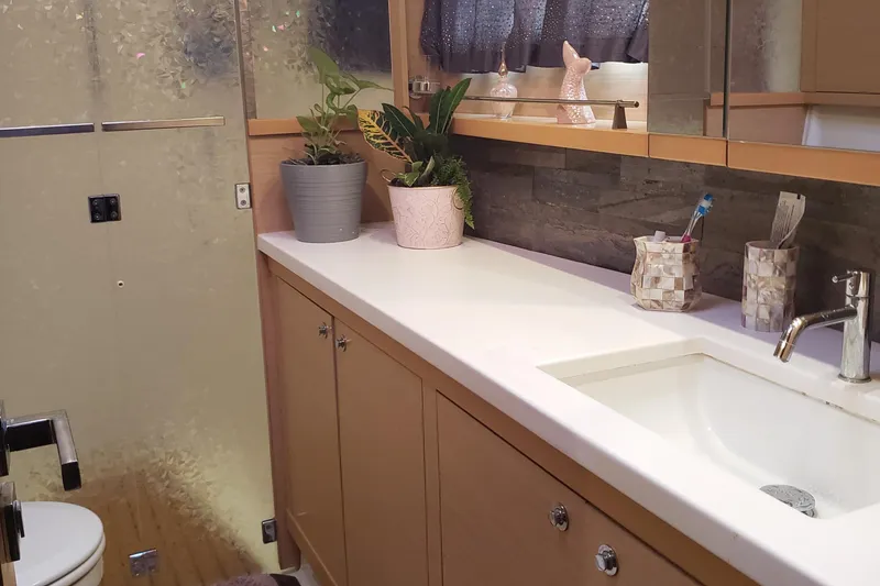 Slide: The Image of Modern bathroom on 2011 Lagoon 450 yacht with plants and sleek fixtures. - 19