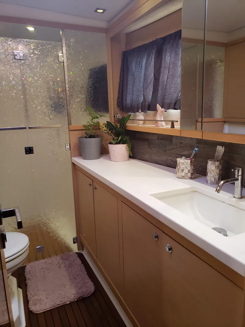 Slide: The Image of Luxurious bathroom in 2011 Lagoon 450 yacht with modern fixtures and elegant decor. - 20