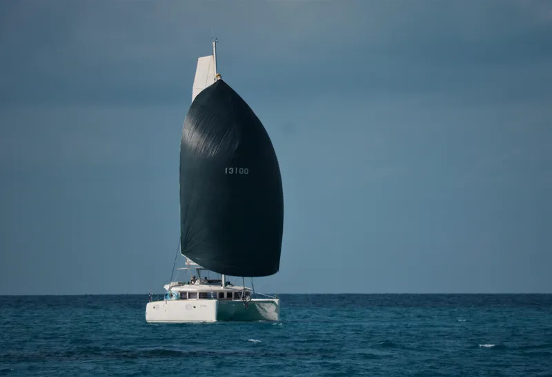 Slide: The Image of Sailing catamaran Lagoon 450, 2011 model, cruising on open sea with large sail. - 23