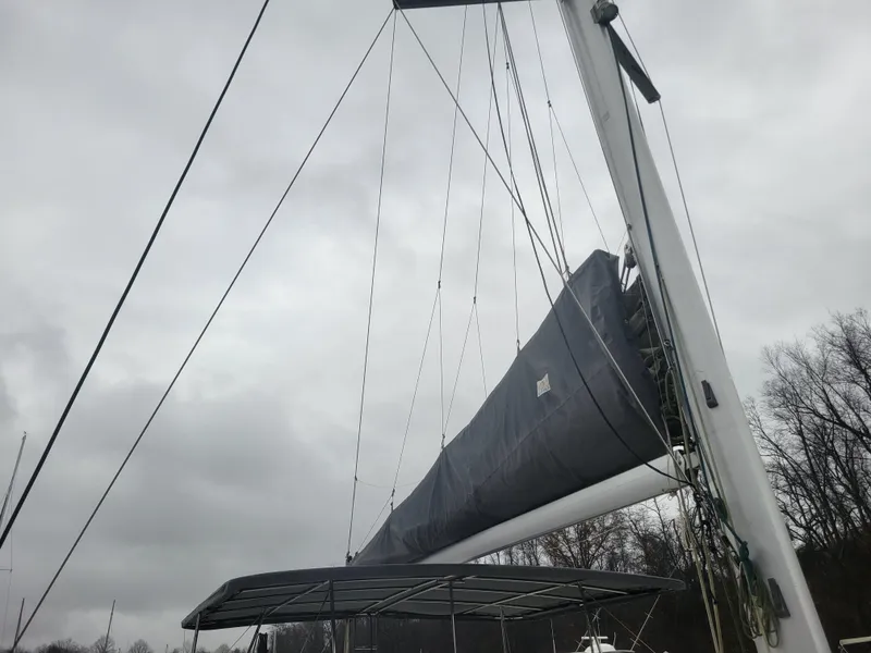 Slide: The Image of Sailboat mast and rigging of 2011 Lagoon 450 under cloudy sky. - 26