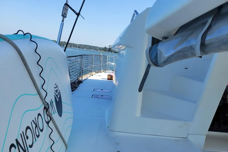 Slide: The Image of 2011 Lagoon 450 catamaran deck with ocean view and safety netting. - 31