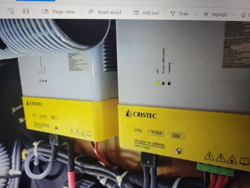 Slide: The Image of Cristec battery chargers in a 2011 Lagoon 450 yacht, featuring yellow casings and wiring. - 41