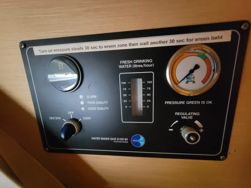 Slide: The Image of Control panel of a 2011 Lagoon 450 water maker system, showing pressure and water quality indicators. - 43